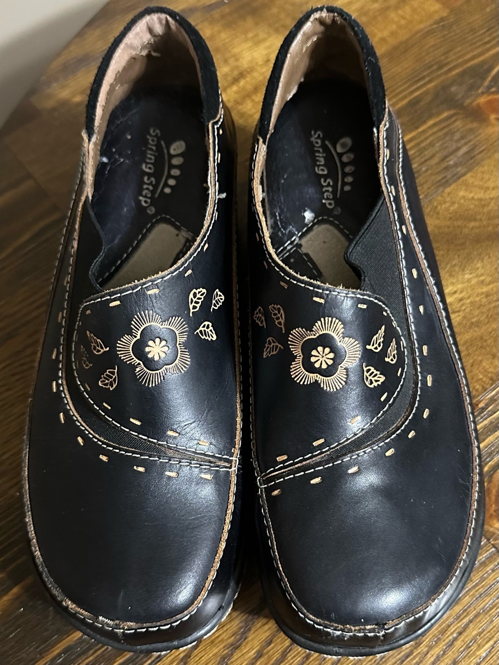 Spring Step Black Slip-On Mules with Gold Floral Embroidery
